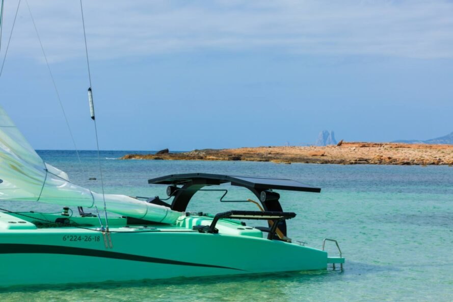 green catamaran at sea