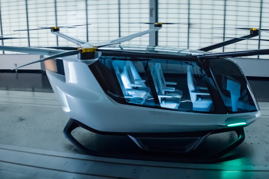 rendering of white aircraft in a hangar