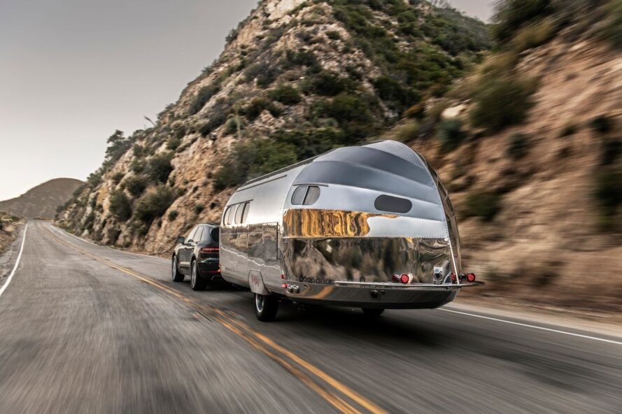 aluminum camper near a mountainside
