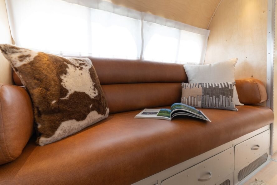 leather bench with patterned pillow