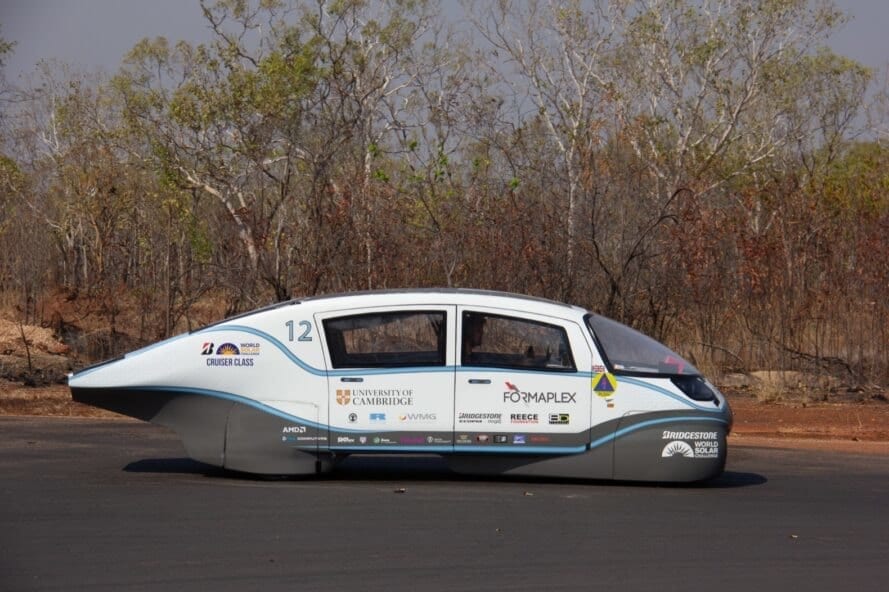 side view of white solar-powered electric car