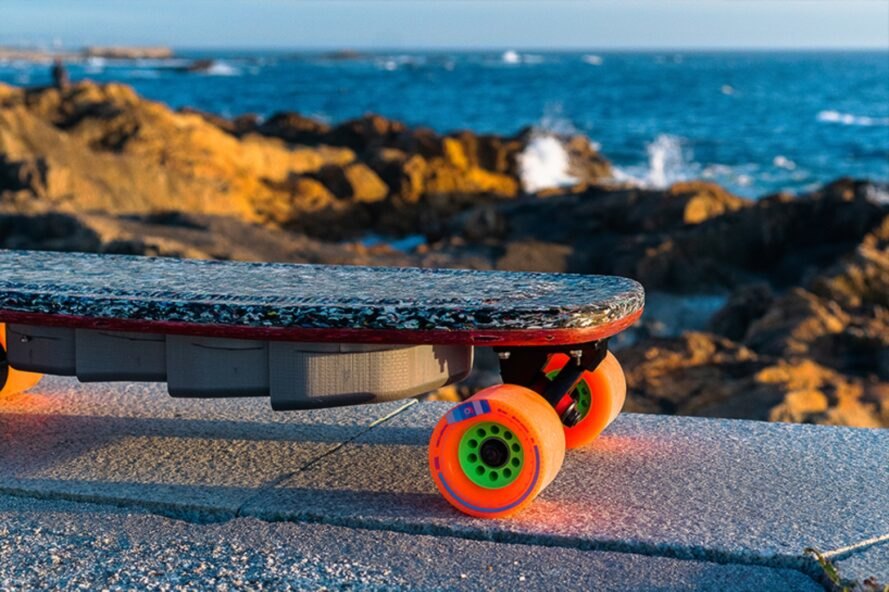 skateboard with bright orange wheels