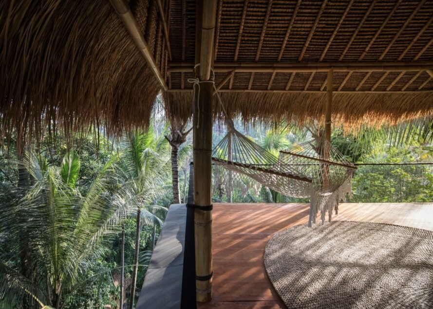 covered deck with thatched roof