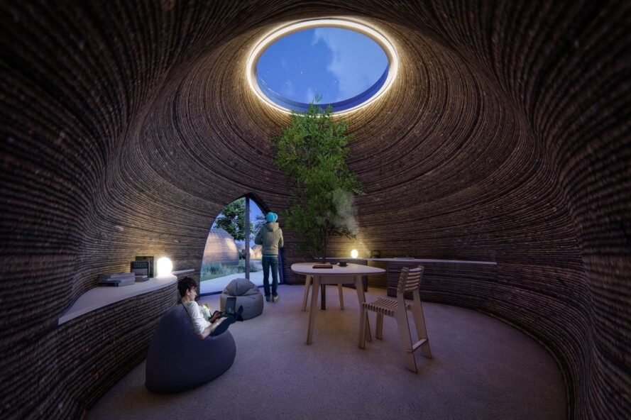 people hanging out in round room with skylight